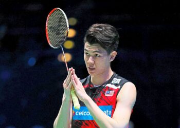 Malaysia's Lee Zii Jia gestures after winning a game against Netherlands' Mark Caljouw during their men's singles semi-final match on day four of the All England Open Badminton Championship at the Utilita Arena in Birmingham, central England, on March 20, 2021. (Photo by Adrian DENNIS / AFP)