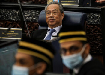 Malaysia's Prime Minister Muhyiddin Yassin reacts during a session of the lower house of parliament, in Kuala Lumpur, Malaysia July 13, 2020. REUTERS/Lim Huey Teng
