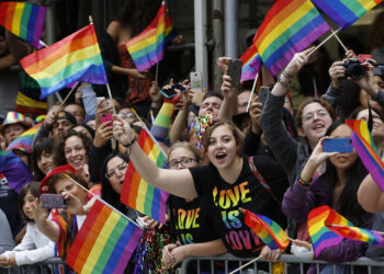 A crowd waves rainbow flags during the Heritage Pride March in New York on Sunday.