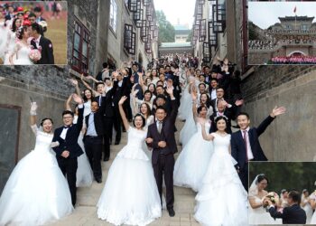 WUHAN, CHINA - OCTOBER 15:  Couples participate in a group wedding ceremony on a playground near Science Building at Wuhan University on October 15, 2016 in Wuhan, Hubei Province of China. The 123 couples, graduates of Wuhan University, held a group wedding in presence of their headmaster Li Xiaohong to celebrate the 123rd anniversary of Wuhan University.  (Photo by VCG/VCG via Getty Images)