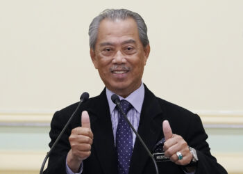 Malaysian new Prime Minister Muhyiddin Yassin, thumbs up during a press conference at prime minister's office in Putrajaya, Malaysia, Monday, March 9, 2020. Muhyiddin unveiled his Cabinet on Monday, saying he will have no deputy but will instead appoint four senior ministers in the move that helped him dodge the tricky issue of succession in his Malay0majority government. (AP Photo/Vincent Thian)
