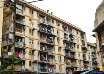 74759814 - residential building with clothing lines in kuala lumpur