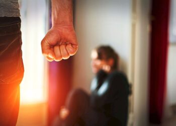 Man beating up his wife illustrating domestic violence