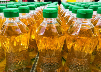 Closed up pile of bottled palm oil in the market