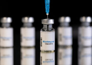 FILE PHOTO: Mock-up vials labeled "Monkeypox vaccine" and medical syringe are seen in this illustration taken, May 25, 2022. REUTERS/Dado Ruvic
