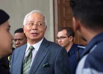 KUALA LUMPUR, MALAYSIA - AUGUST 08: Malaysia's former Prime Minister Najib Razak exits the Kuala Lumpur High Court on August 8, 2018 in Kuala Lumpur, Malaysia. Malaysia's former Prime Minister Najib Razak was charged with three counts of money laundering on Wednesday after being hit with new charges in connection with a multi-billion-dollar scandal at state fund 1Malaysia Development Berhad (1MDB) that contributed to his shock election defeat by 93-year-old veteran politician Mahathir Mohamad in May. Najib faces up to 15 years in jail for each charge as he pleaded not guilty to the charges and was released on bail.(Photo by Ore Huiying/Getty Images)