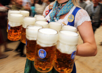 MUNICH, GERMANY - SEPTEMBER 21: A waitress carries 1-liter-mugs of beer during the opening weekend of the 2019 Oktoberfest on September 21, 2019 in Munich, Germany. This year's Oktoberfest, which will draw millions of visitors from all over the world, will run from October 21 through October 6. (Photo by Johannes Simon/Getty Images)