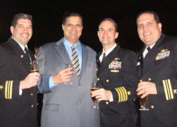 NO NEWS SERVICE--A cocktail reception aboard the USS Blue Ridge in Tokyo in 2009. From left: Lt. Al Munoz, a 7th Fleet staff officer; Leonard Glenn Francis; Capt. James Dolan, Francis is flanked by Lt. Al Munoz (left); Capt. James Dolan, the 7th Fleet logistics chief; and Cmdr. Jose Luis Sanchez, a deputy logistics officer. Dolan has been charged in federal court with bribery and conspiracy; he has pleaded not guilty. Sanchez was convicted of bribery in 2015. (Photo obtained by The Washington Post)