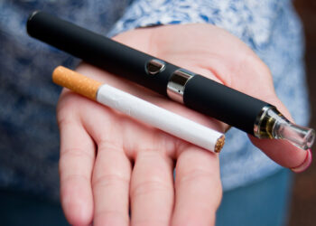 closeup of hand of woman with e-cigarette